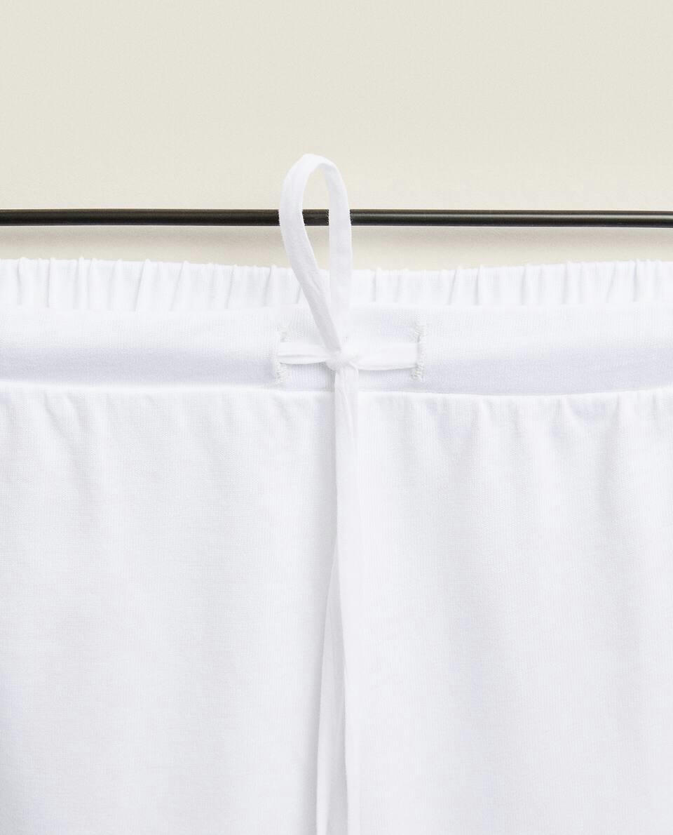 CROPPED TROUSERS WITH LACE TRIM