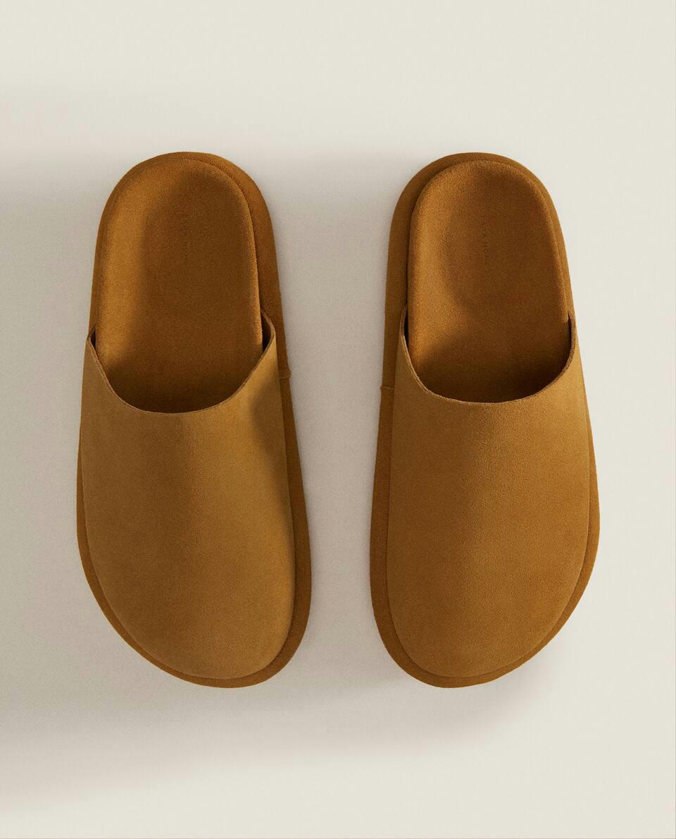 LEATHER MULE SLIPPERS WITH SOLE DETAIL