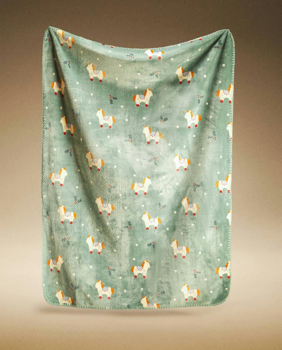 CHILDREN’S FLEECE BLANKET WITH CHRISTMAS ROCKING HORSE