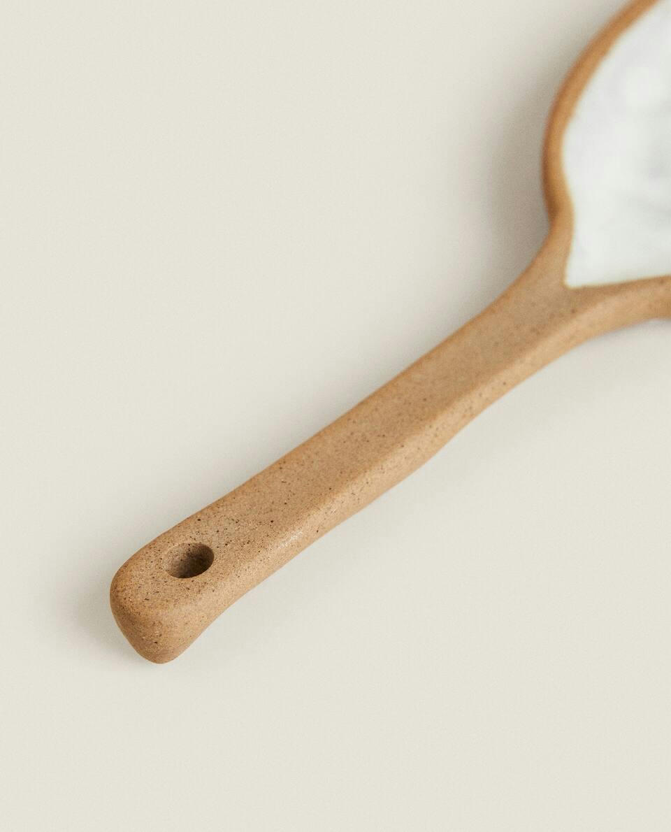 SPOON WITH RAISED DESIGN
