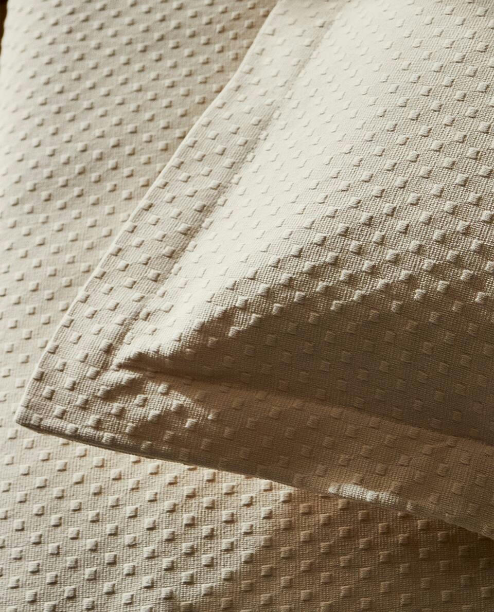 CUSHION COVER WITH POLKA DOT DESIGN