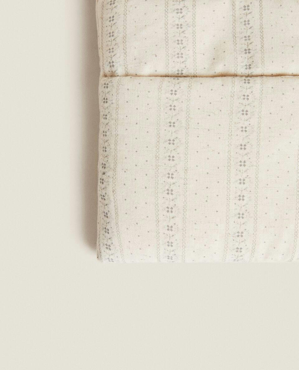 MUSLIN ORGANISER WITH BORDER