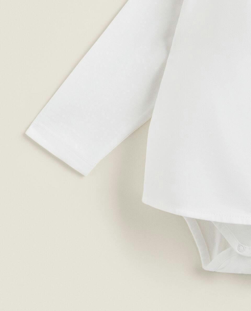 COTTON BODYSUIT WITH RUFFLED NECKLINE