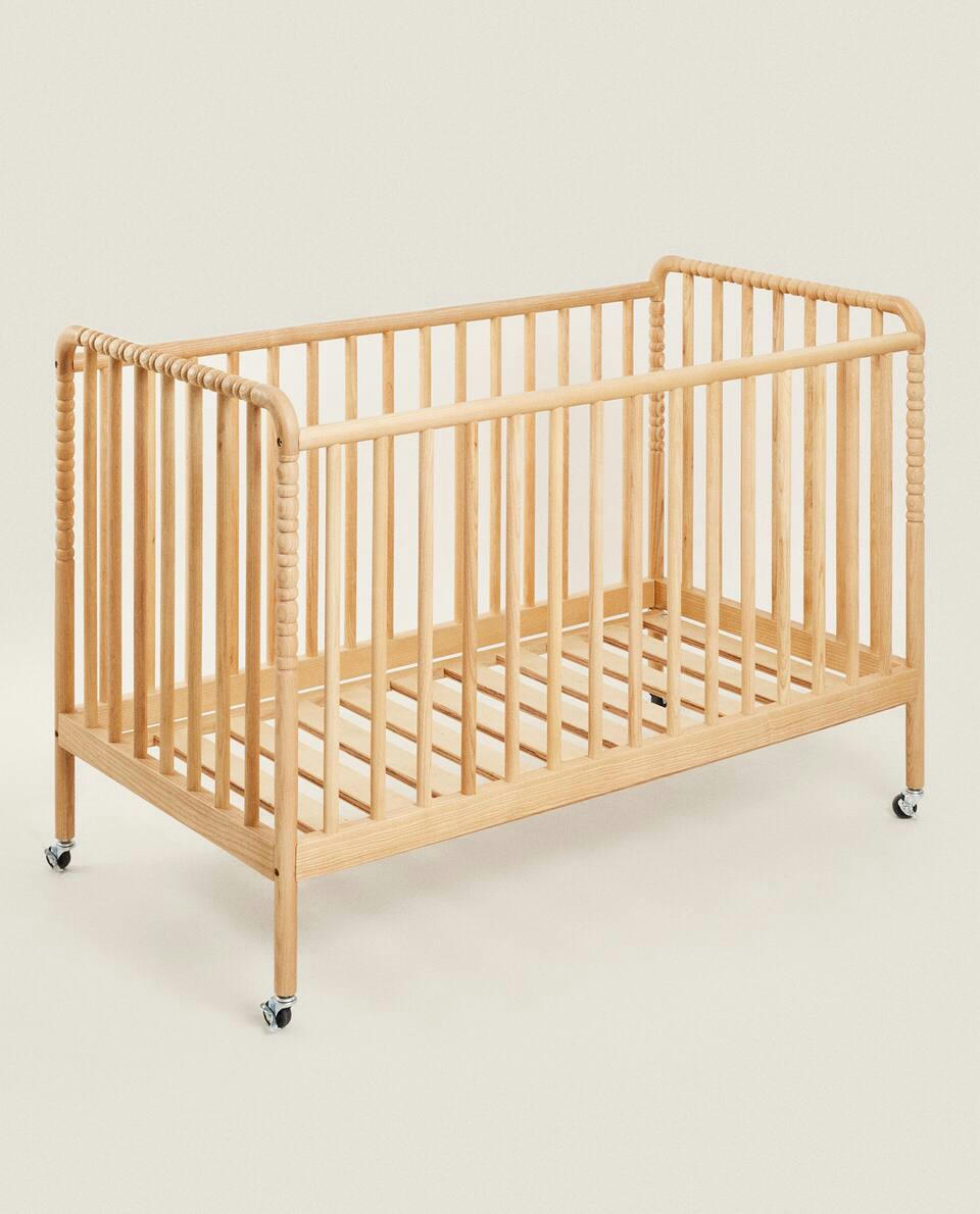 ENGRAVED WOODEN COT