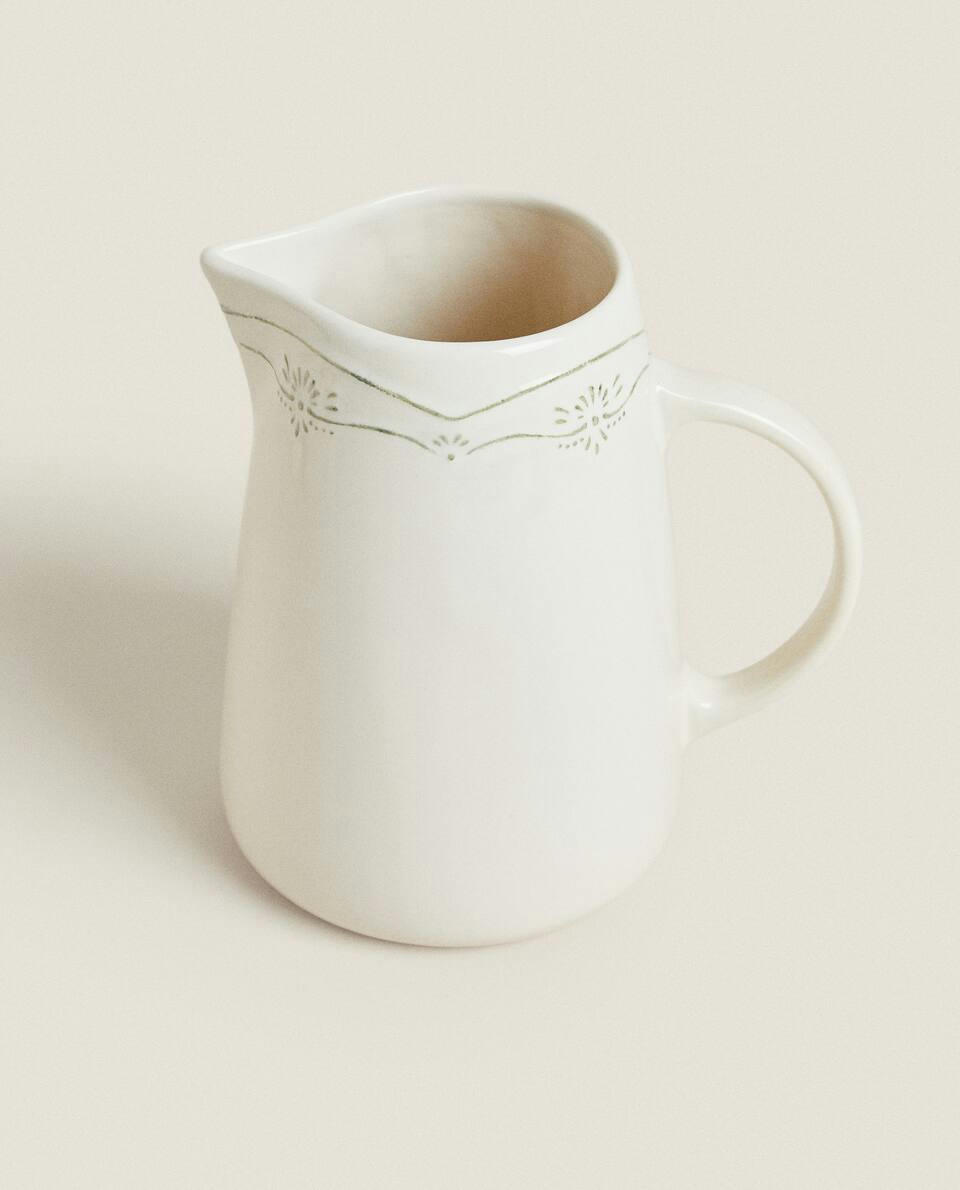 EARTHENWARE JUG WITH RAISED CHRISTMAS DESIGN