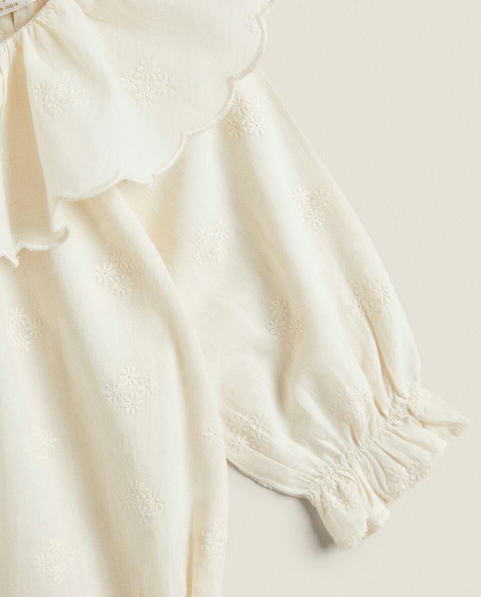 EMBROIDERED RUFFLED BODYSUIT