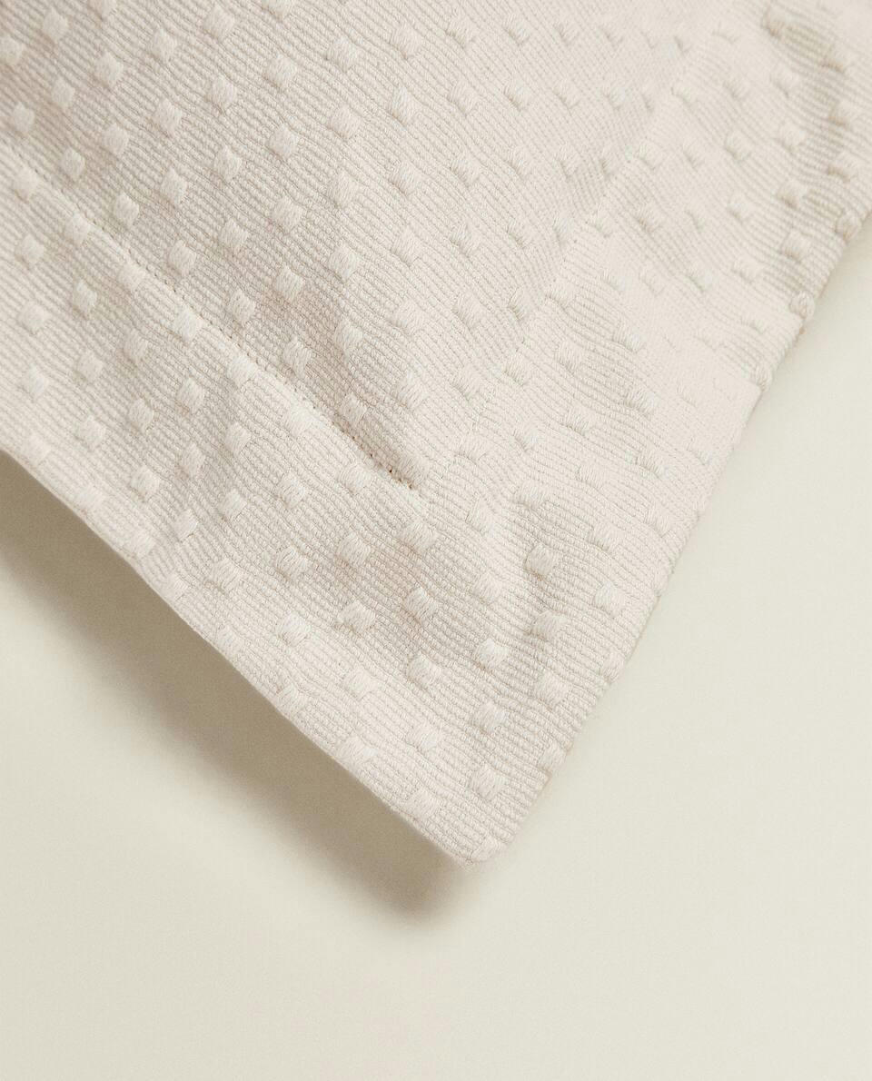 CUSHION COVER WITH POLKA DOT DESIGN