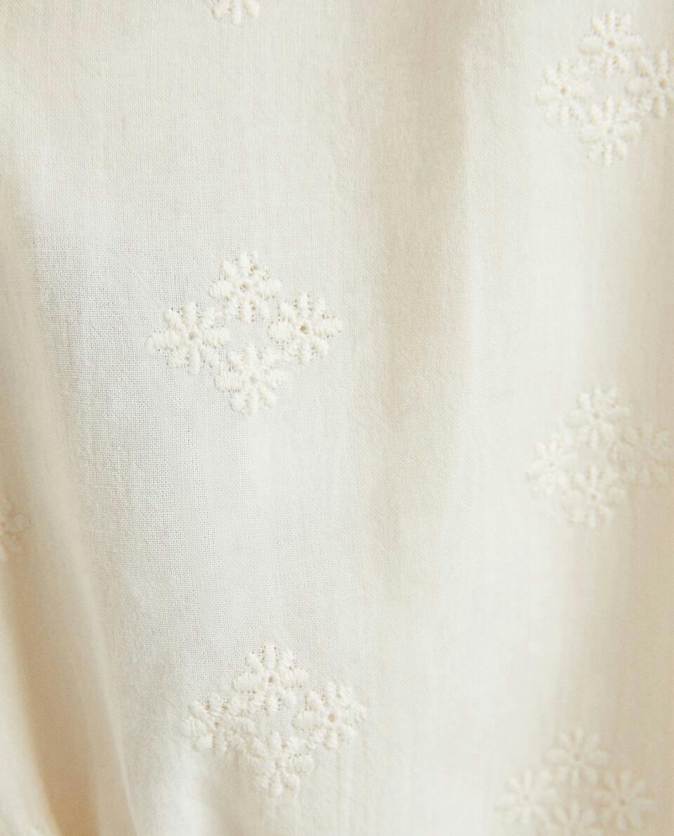 EMBROIDERED RUFFLED BODYSUIT