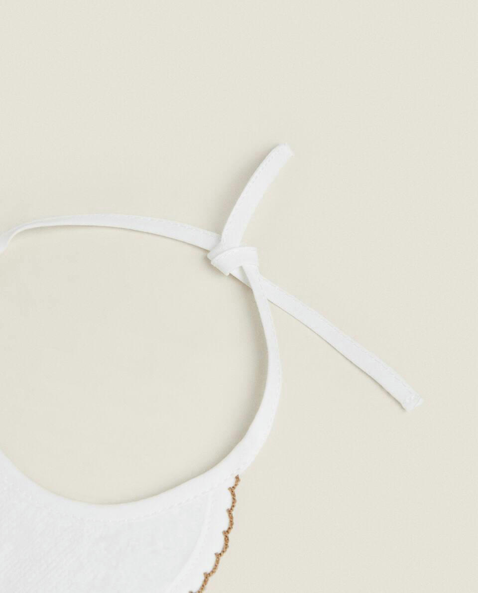 VELOUR BIB WITH TRIM DETAIL