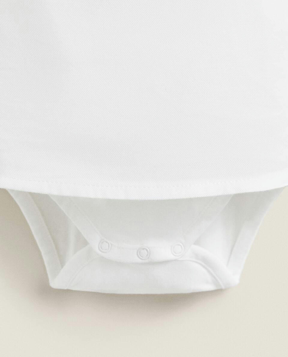 COTTON BODYSUIT WITH RUFFLED NECKLINE