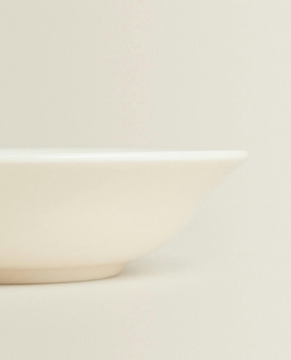 EARTHENWARE BOWL WITH RAISED-DESIGN EDGE