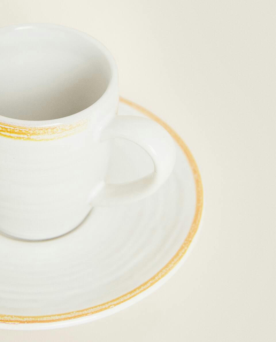 RIMMED COFFEE CUP