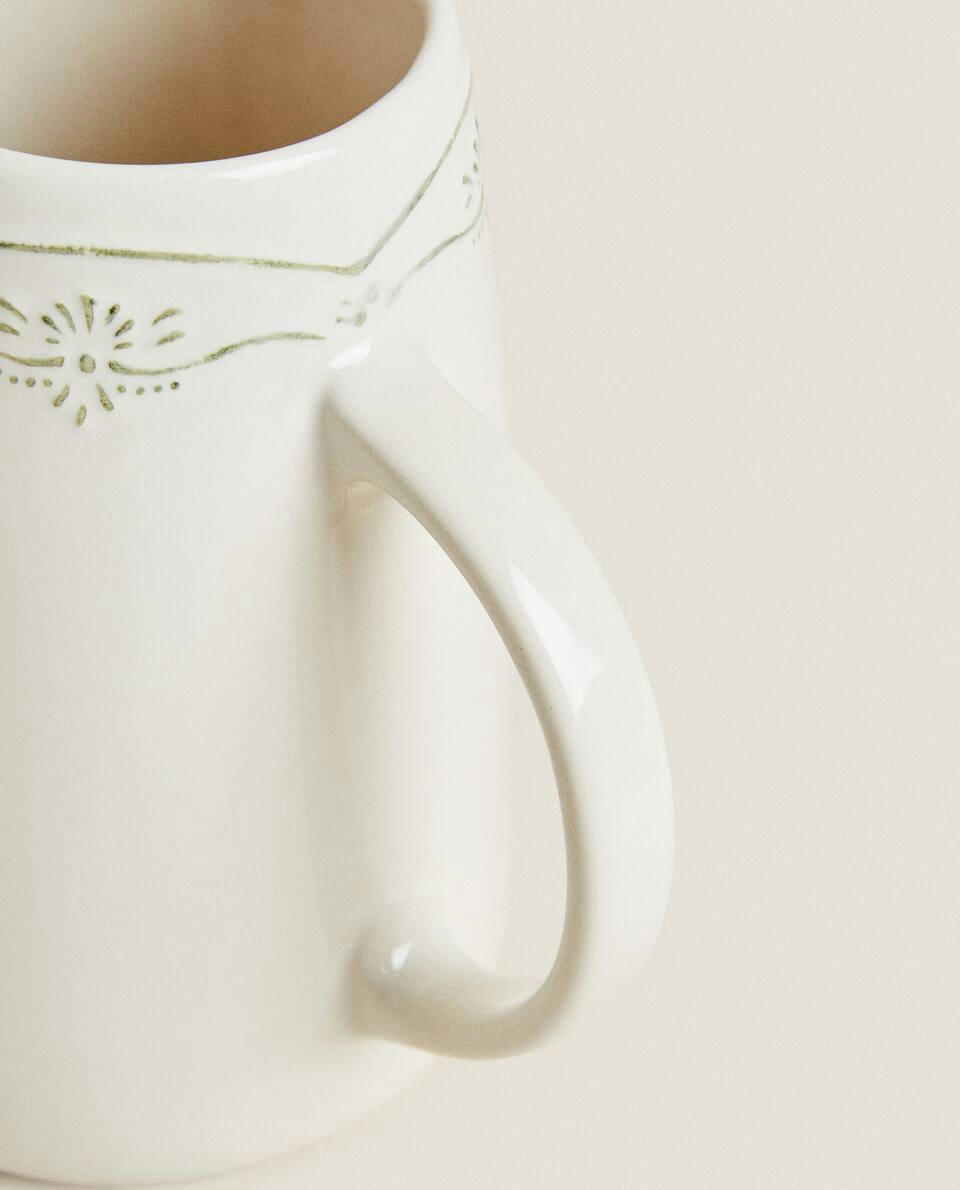 EARTHENWARE JUG WITH RAISED CHRISTMAS DESIGN