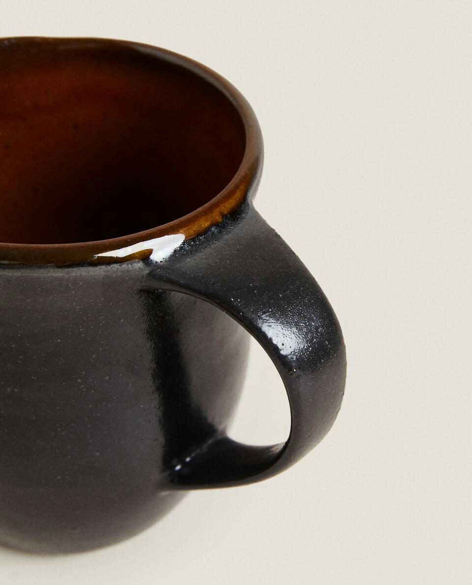 STONEWARE JUG WITH HANDLE