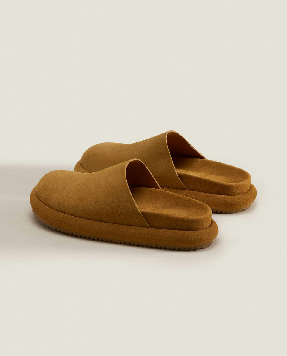 LEATHER MULE SLIPPERS WITH SOLE DETAIL