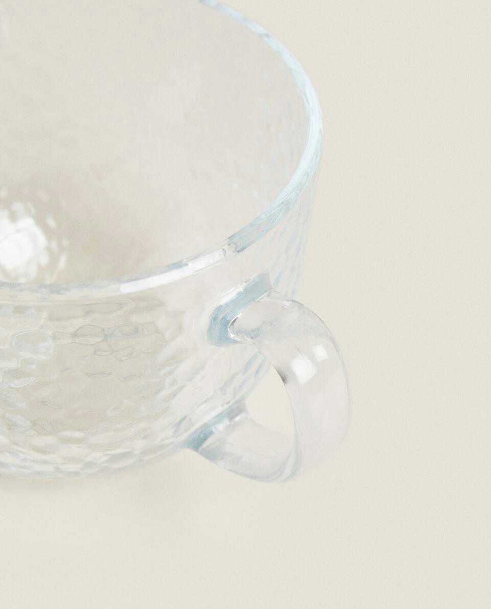 GLASS CUP WITH RAISED DESIGN