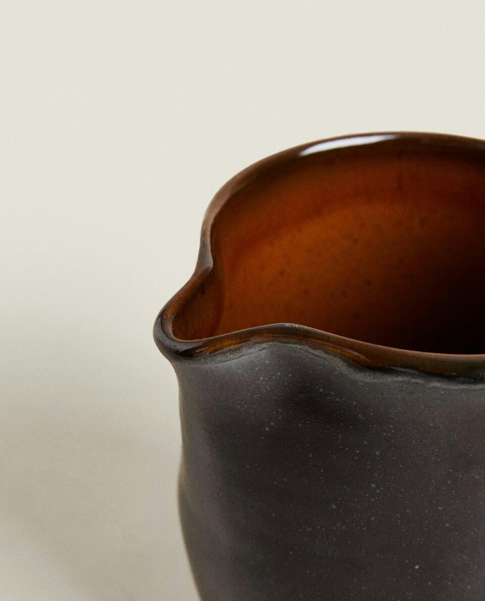 STONEWARE JUG WITH HANDLE