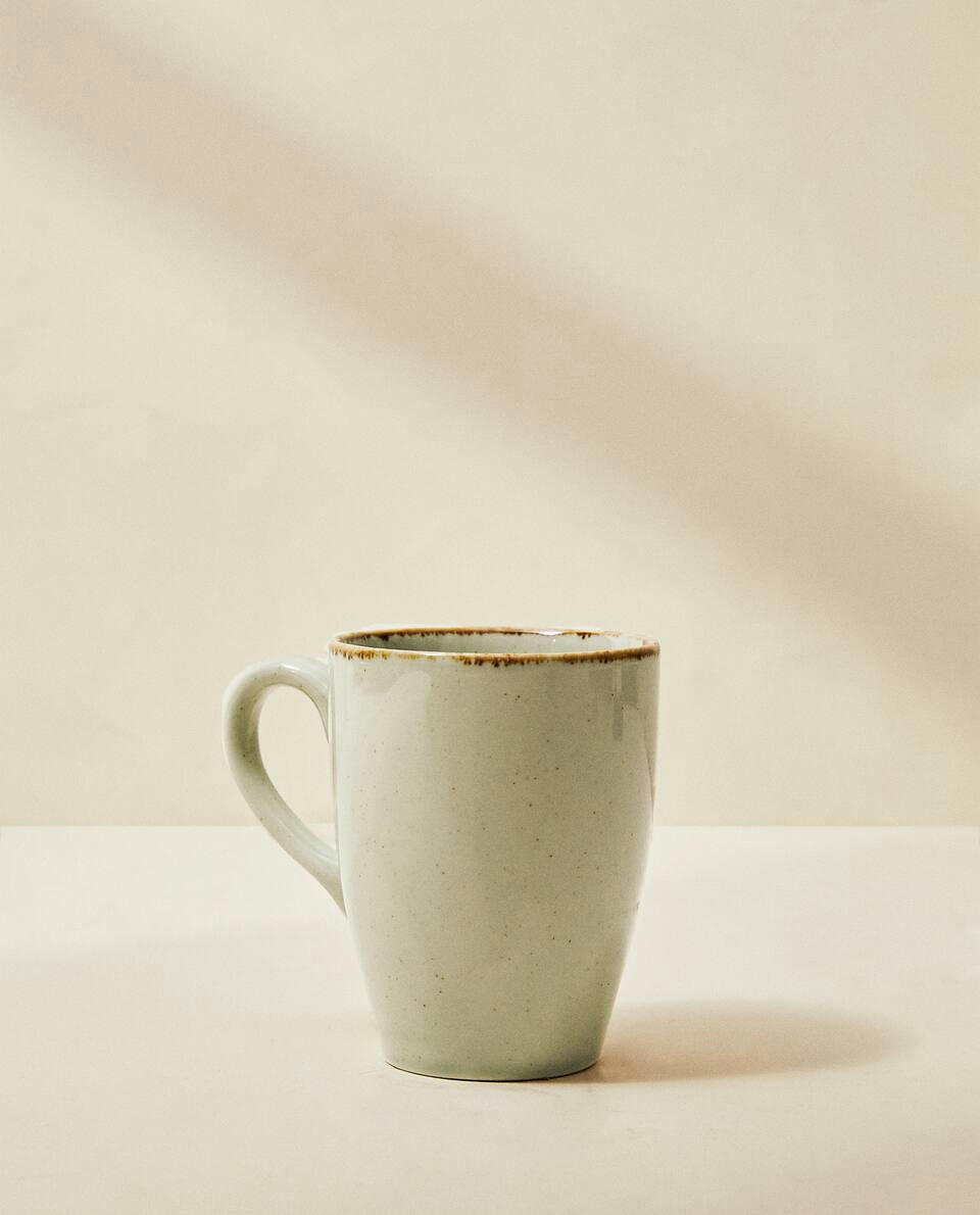 PORCELAIN MUG WITH ANTIQUE FINISH RIM