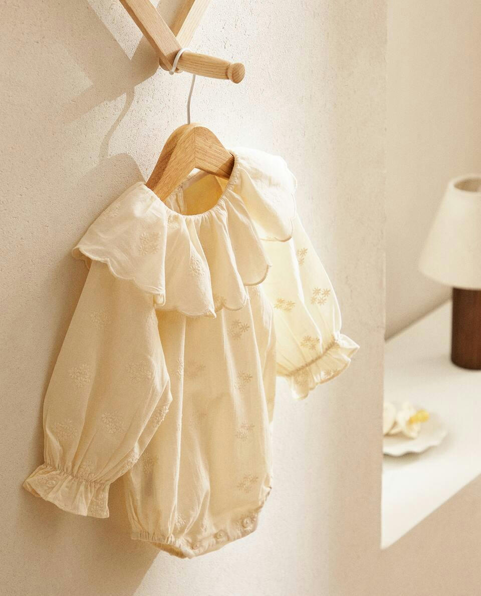 EMBROIDERED RUFFLED BODYSUIT