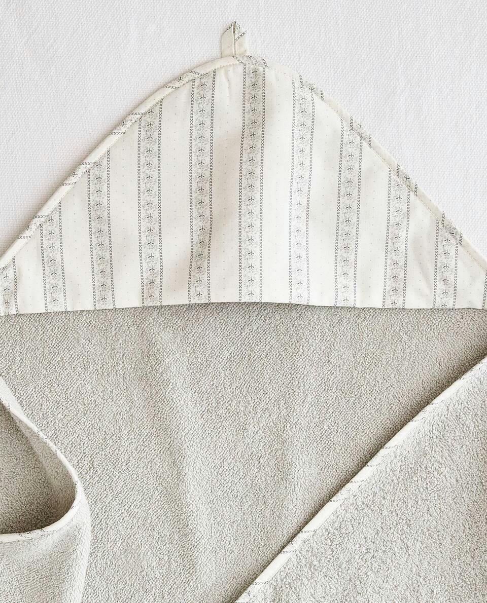 BABY CAPE WITH FLORAL BORDER