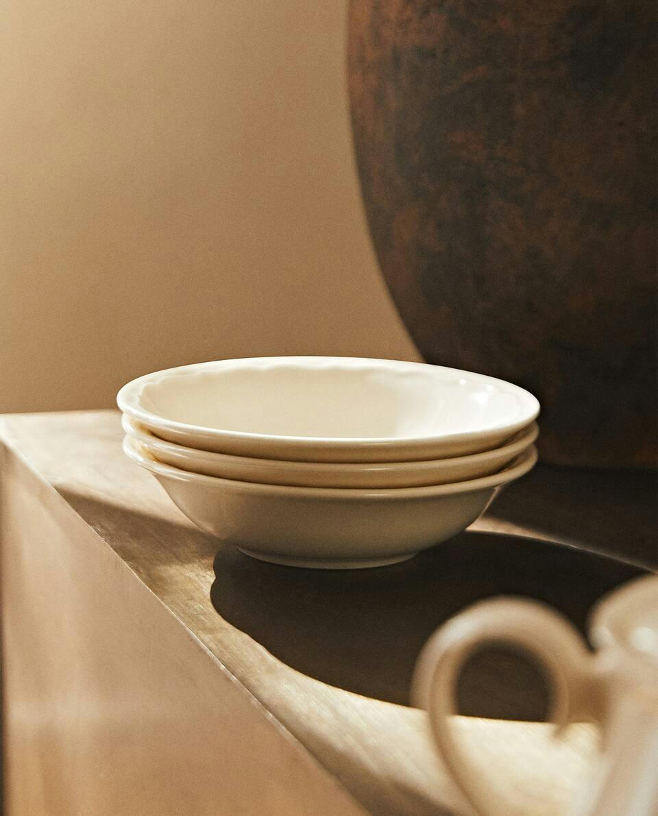 EARTHENWARE BOWL WITH RAISED-DESIGN EDGE