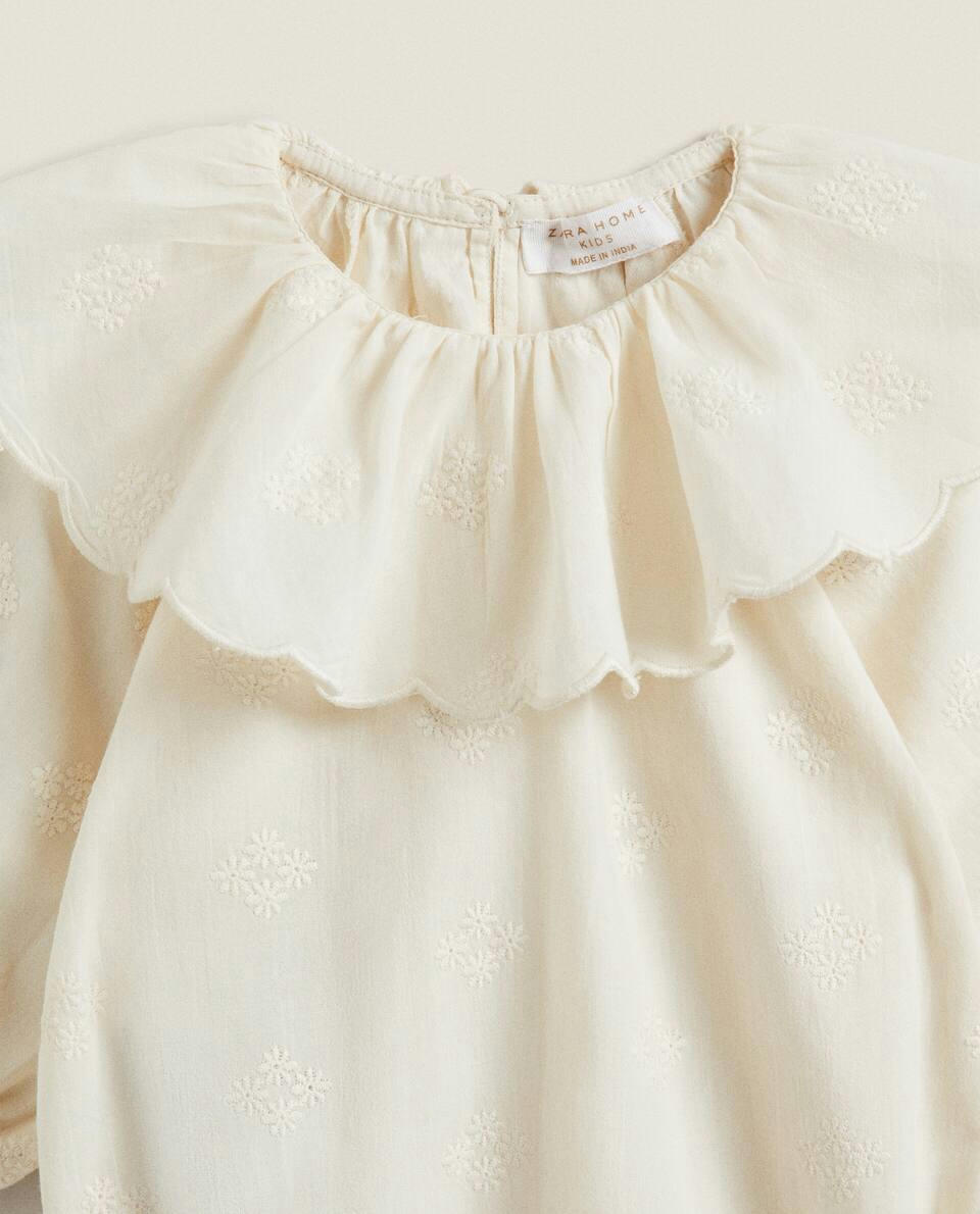 EMBROIDERED RUFFLED BODYSUIT