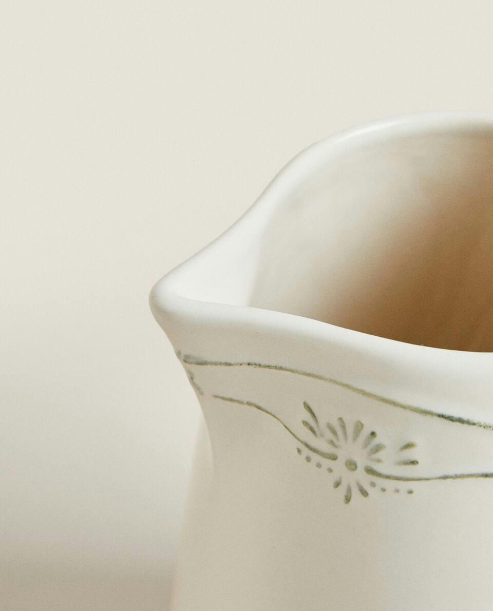 EARTHENWARE JUG WITH RAISED CHRISTMAS DESIGN