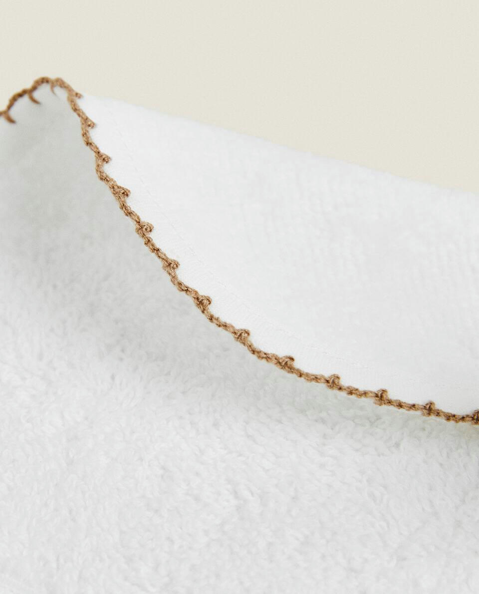 VELOUR BIB WITH TRIM DETAIL