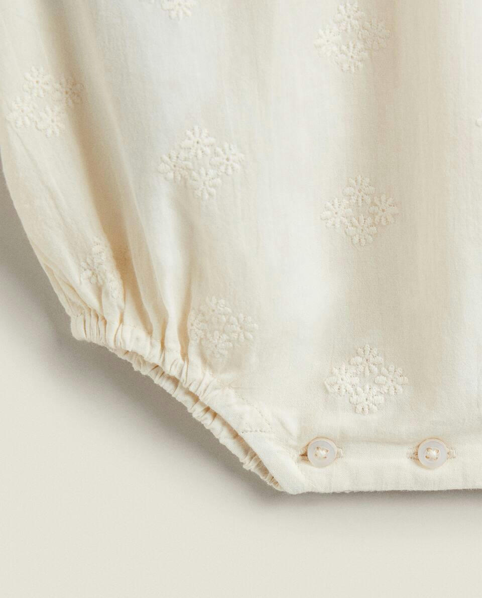 EMBROIDERED RUFFLED BODYSUIT