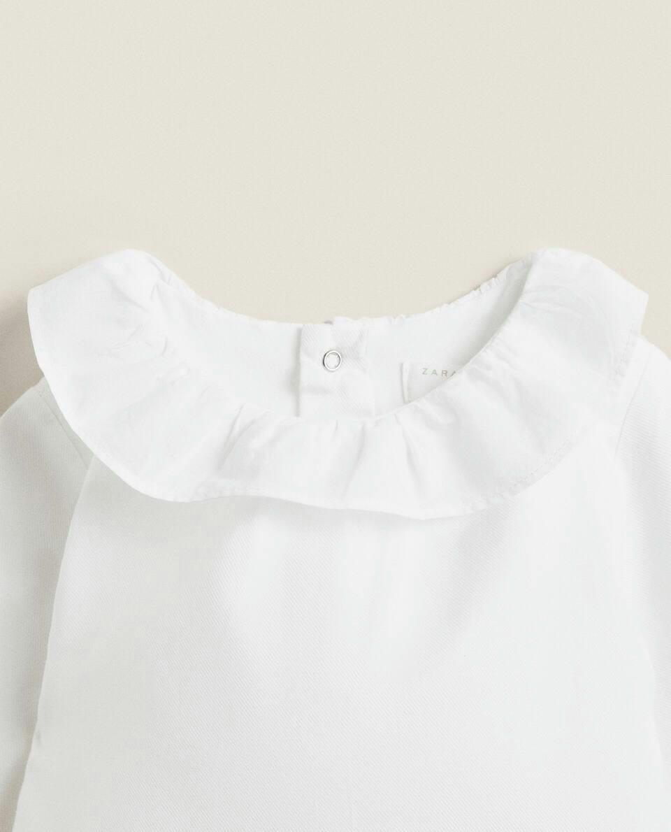 COTTON BODYSUIT WITH RUFFLED NECKLINE