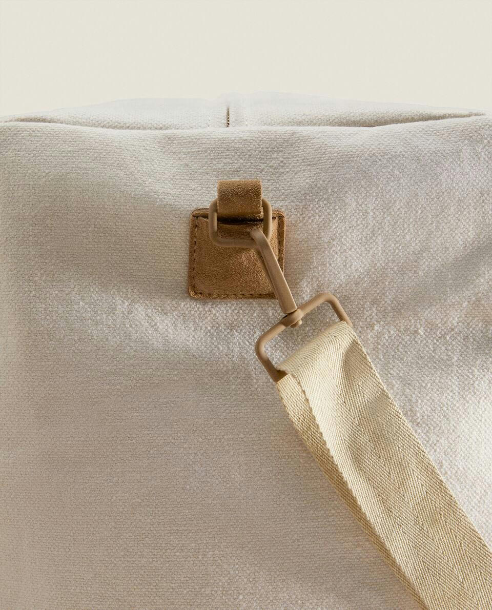 FABRIC TRAVEL BAG WITH LEATHER DETAIL