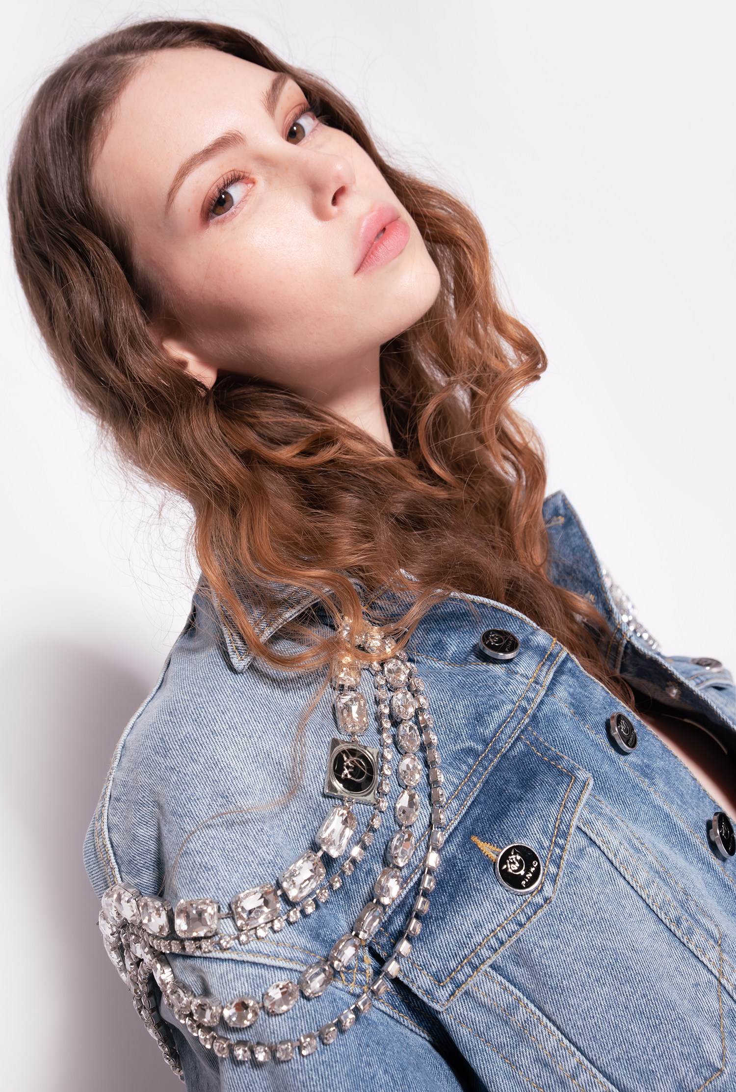 Denim jacket with jewel chains