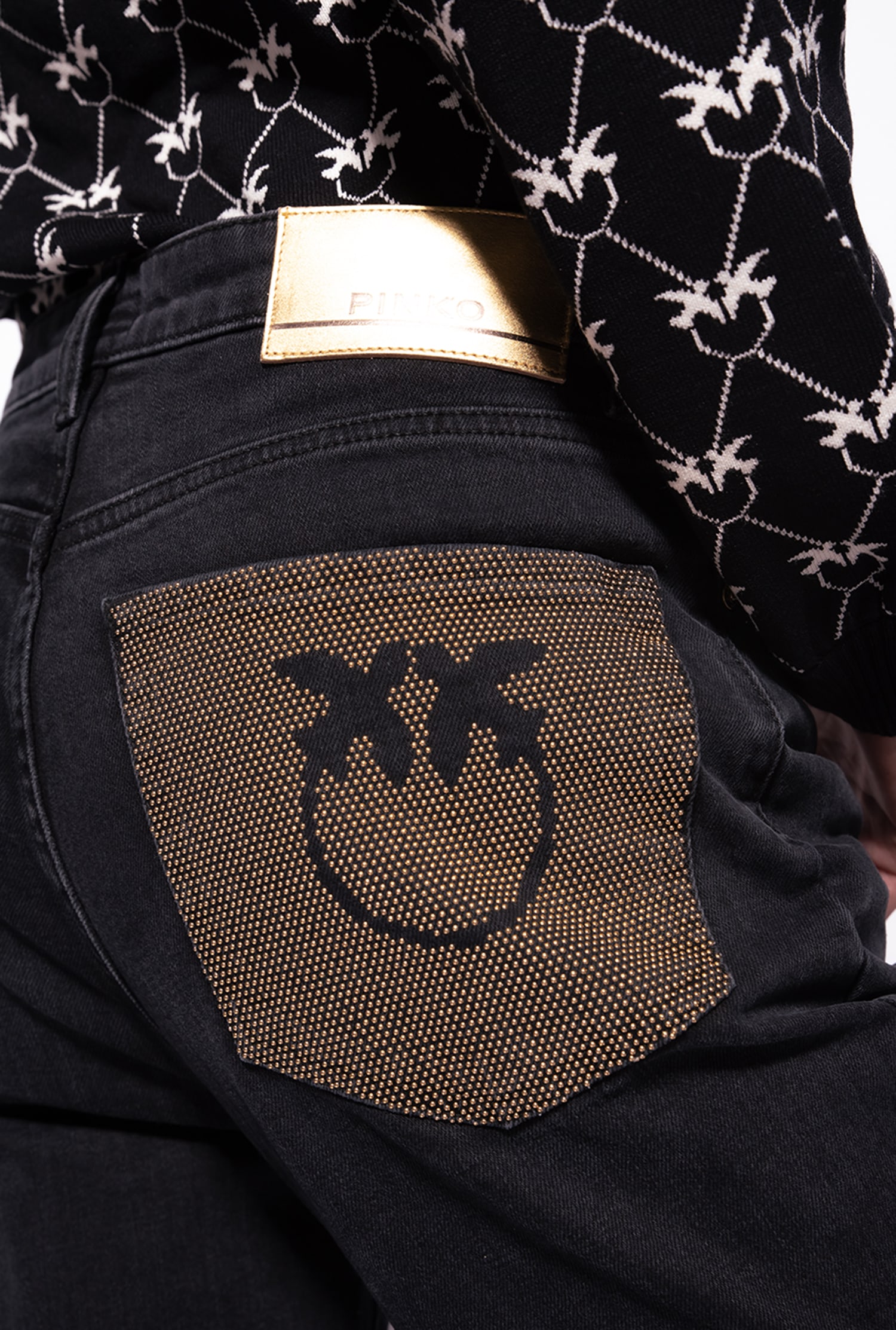 Snug-fitting black denim jeans