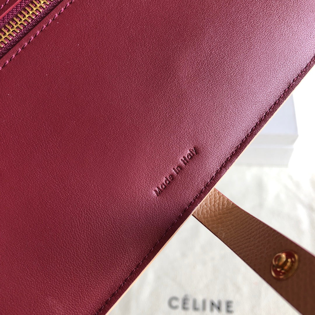 Длинный кошелек Celine — розовый и бордовый — с принтом в виде пальм.