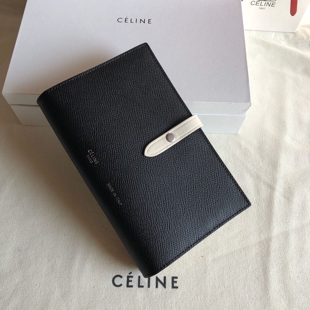 Длинный кошелек Celine — черный и кремовый — с принтом в виде пальм.