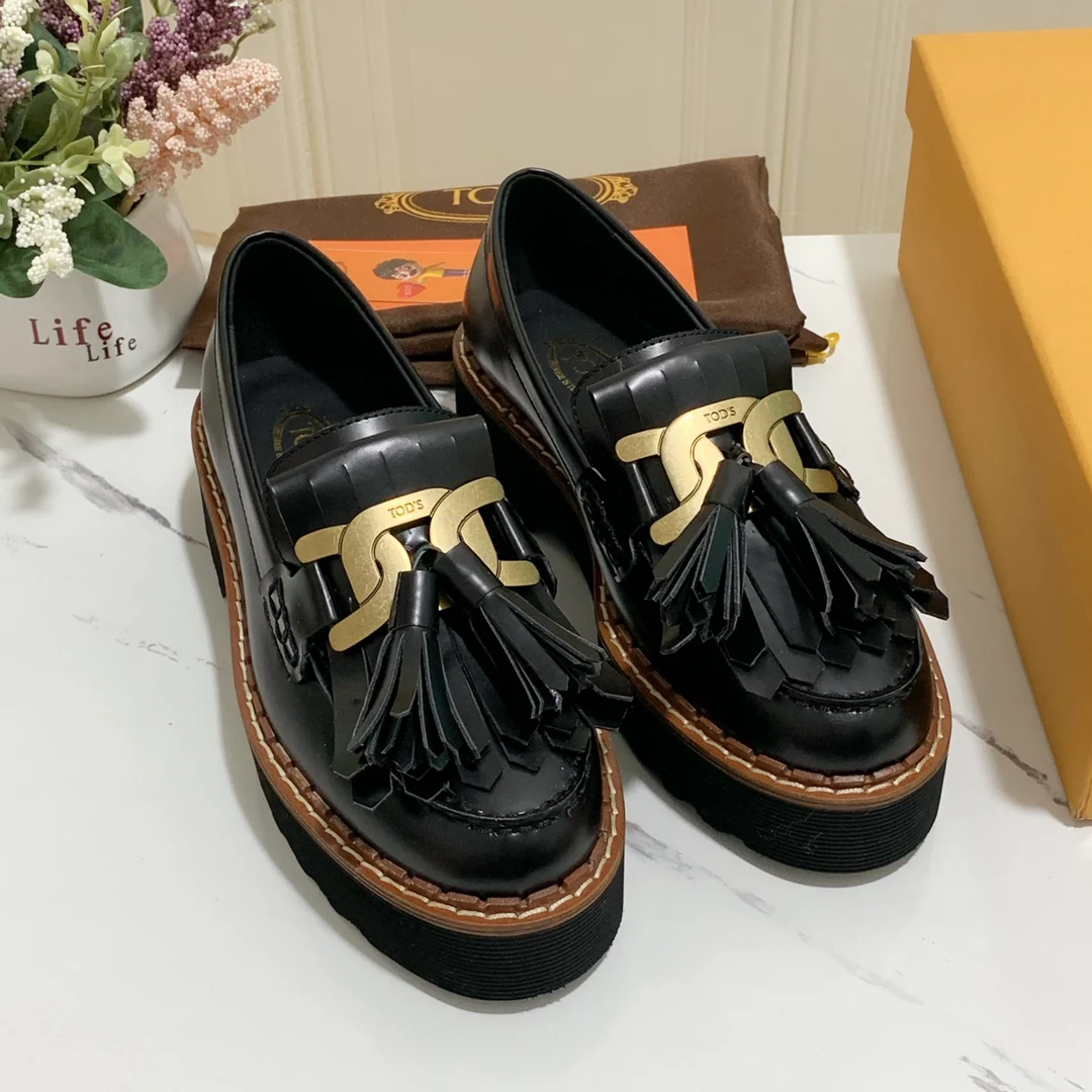 Лоферы на платформе Tods с кисточками