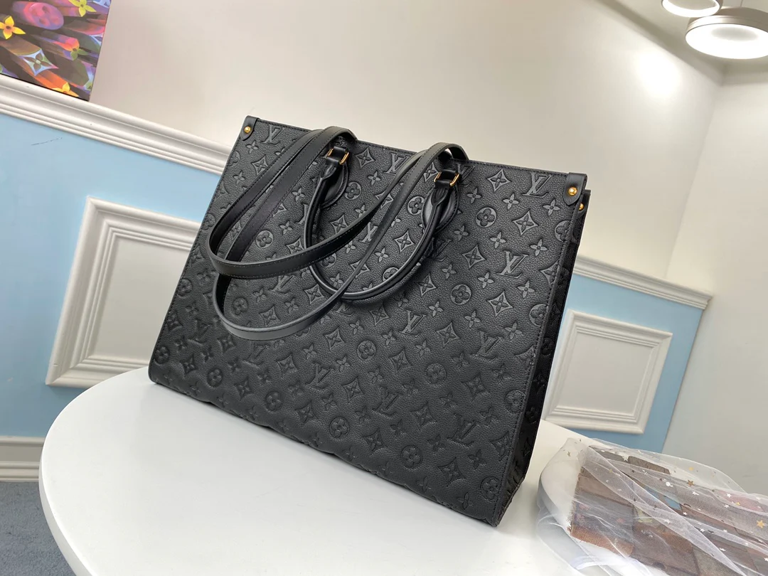 lv-m44925-black embossed-onthego-handbag