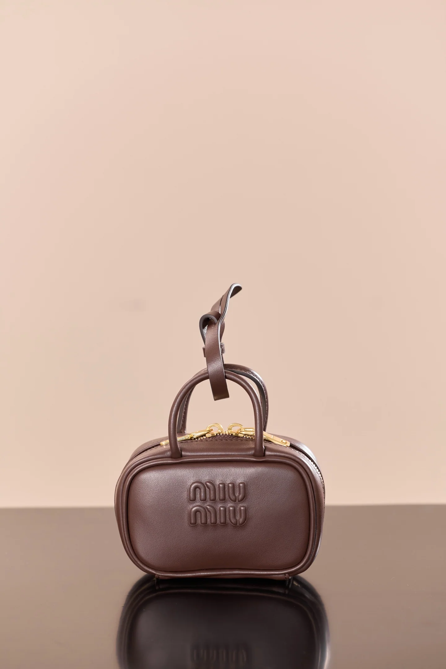 Маленькая кожаная сумочка Miu Miu-5nr036m300, цвет Нанму.