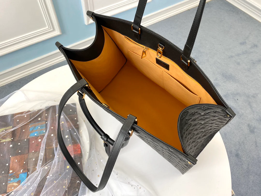 lv-m44925-black embossed-onthego-handbag