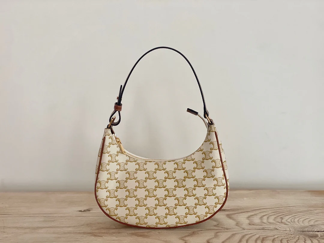 Сумка Ava Triomphe из канваса — белая с монограммой.