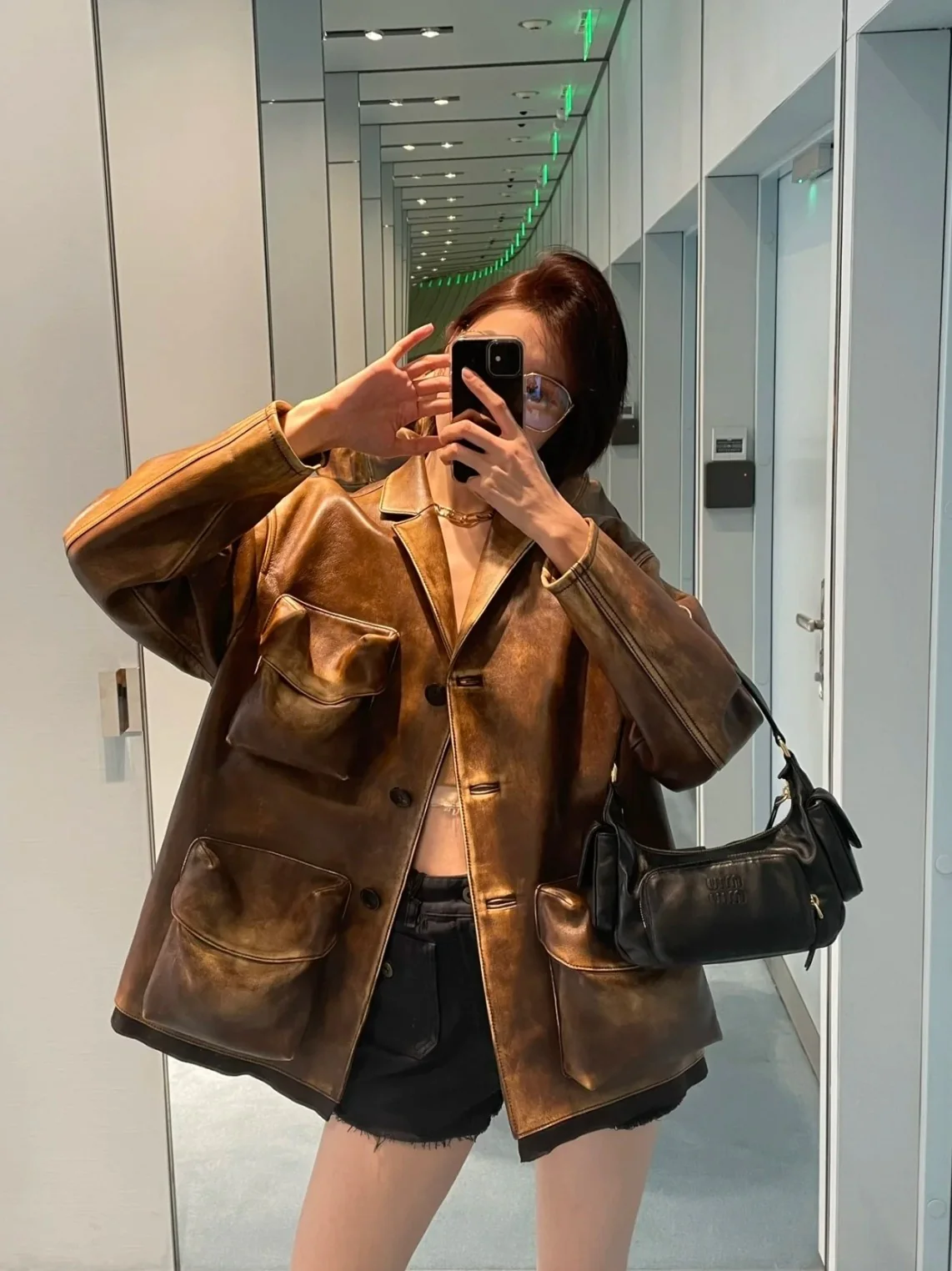 Сумка-клатч Miu Miu из кожи наппа — черная