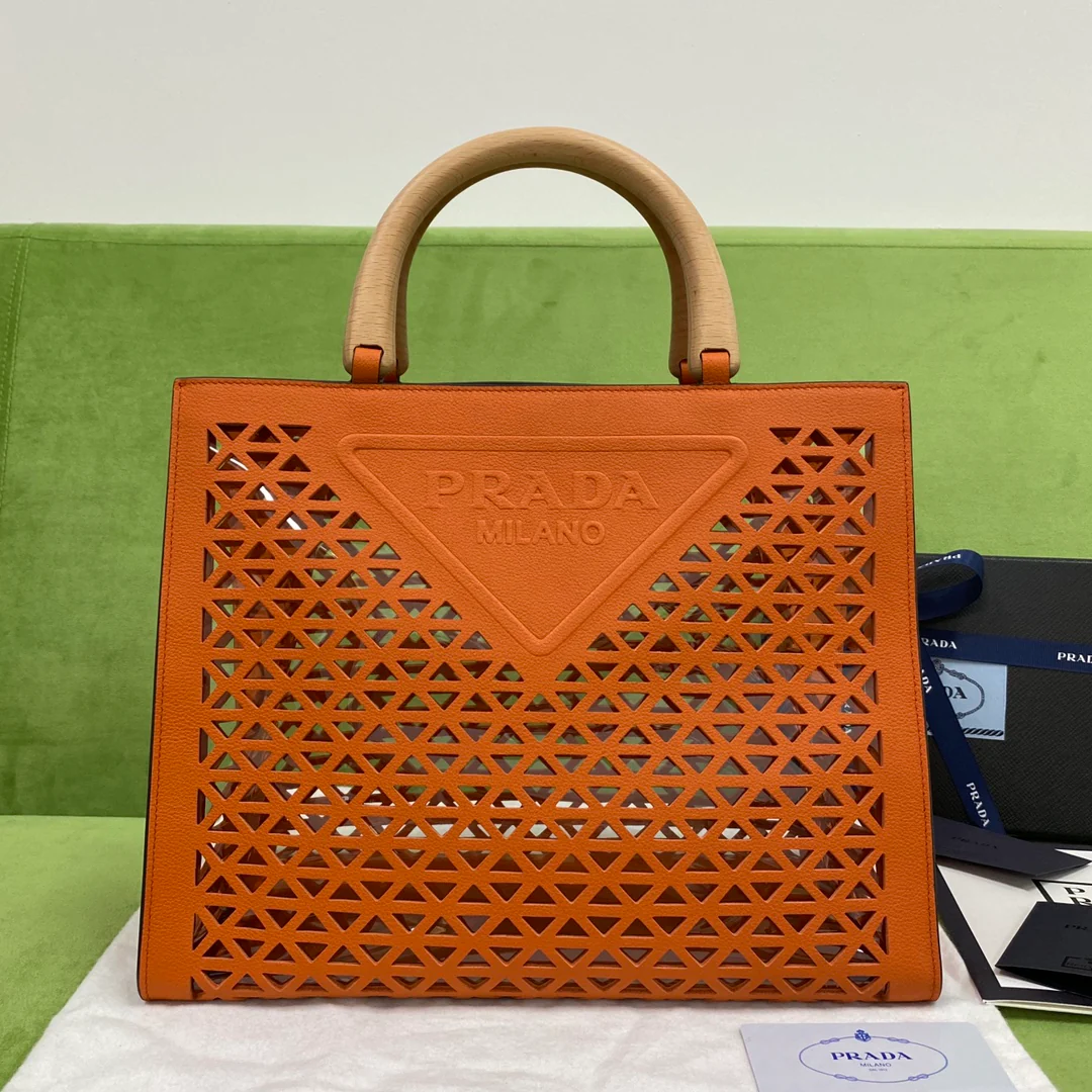 Prada - Новая перфорированная сумка-тоут, оранжевая