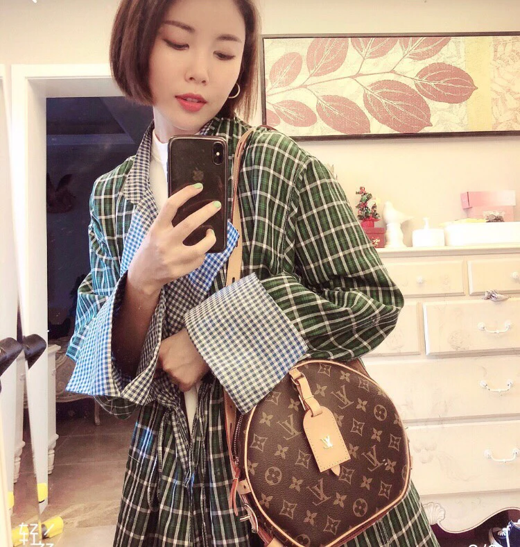 Круглая сумка LV