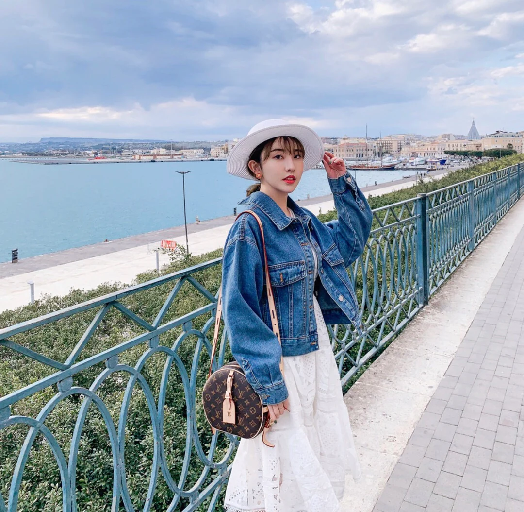 Круглая сумка LV