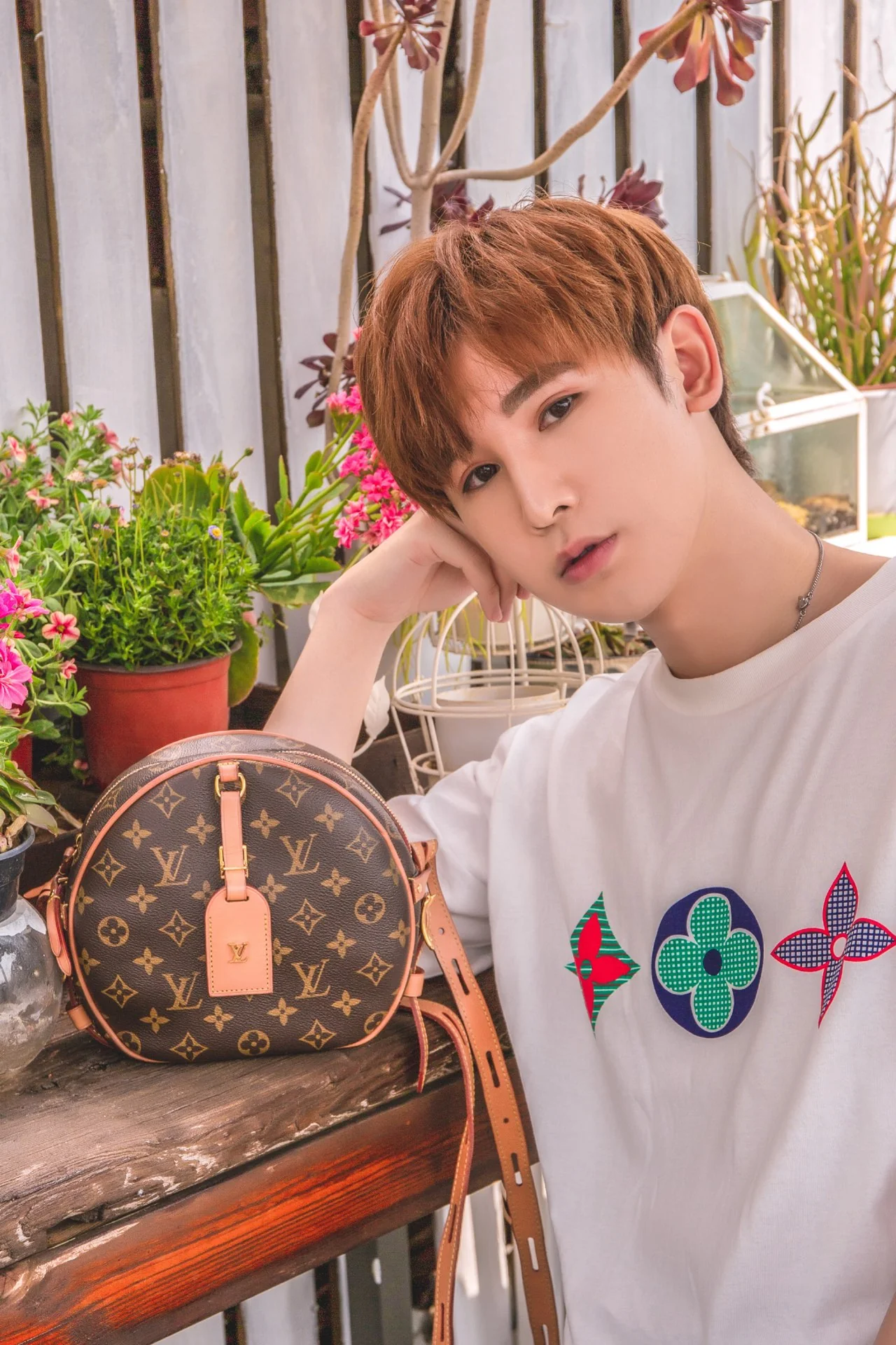 Круглая сумка LV