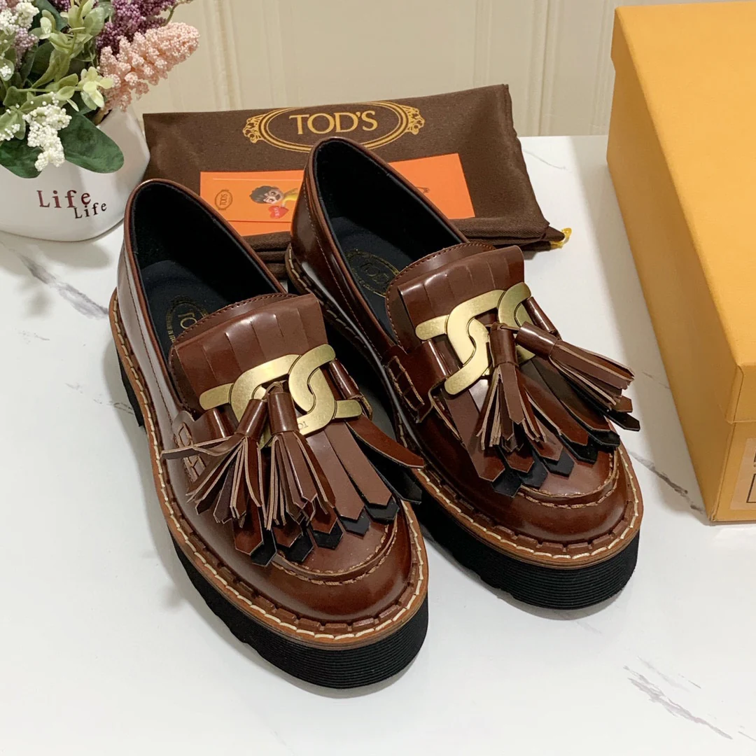 Лоферы на платформе Tods с кисточками