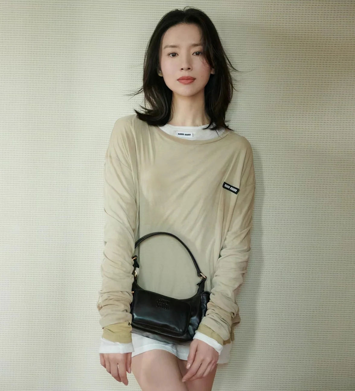 Сумка-клатч Miu Miu из кожи наппа — черная