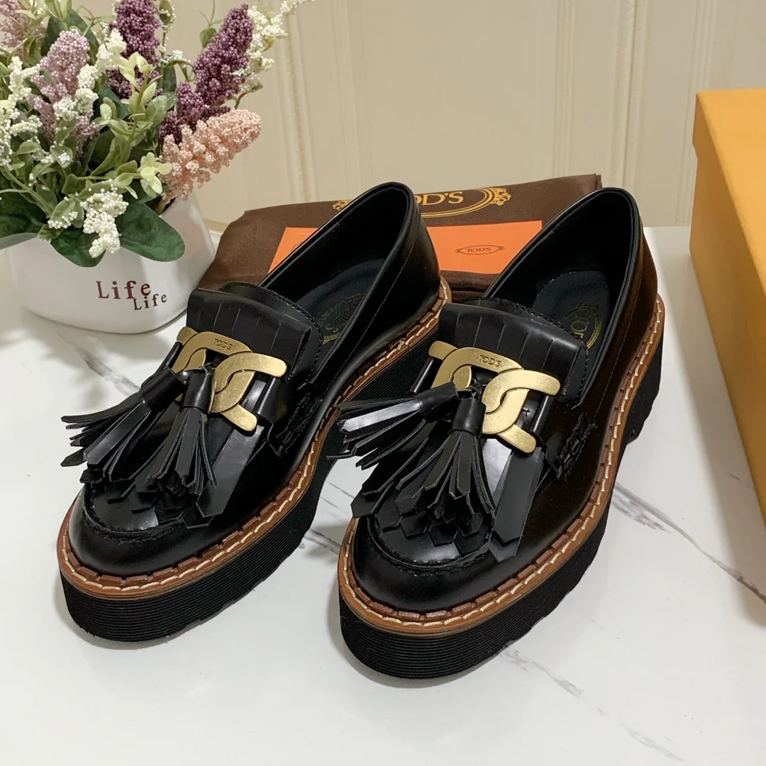 Лоферы на платформе Tods с кисточками