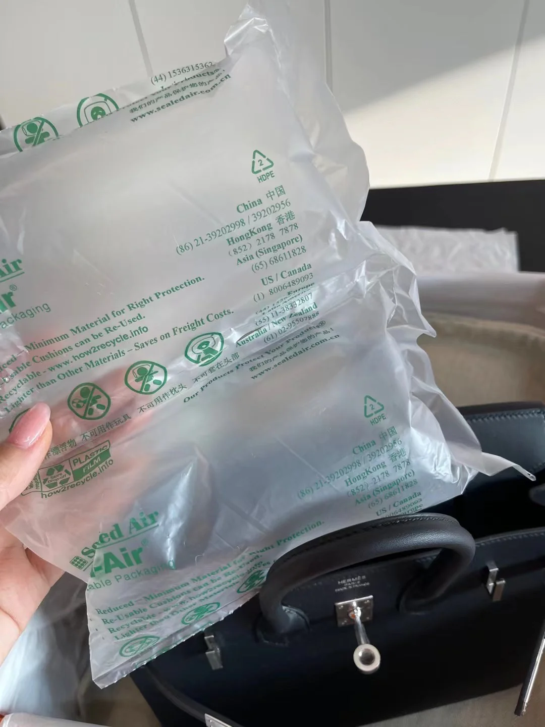 Сумка Hermes Birkin 25 Jonathan Black с серебряной пряжкой и U-образной гравировкой.