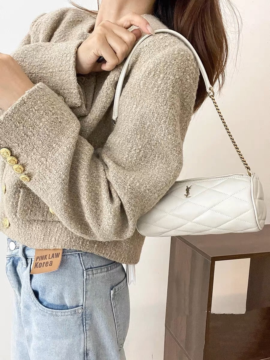 Маленькая цилиндрическая сумка YSL Sade - белая - на фото.